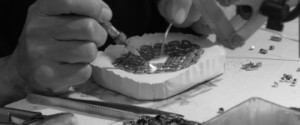 Alfredo at work on a buckle.